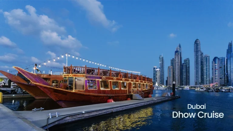 Traditional wooden dhow cruise in Dubai Marina at night with skyline views, luxury dinner experience on Dhow Cruise Dubai